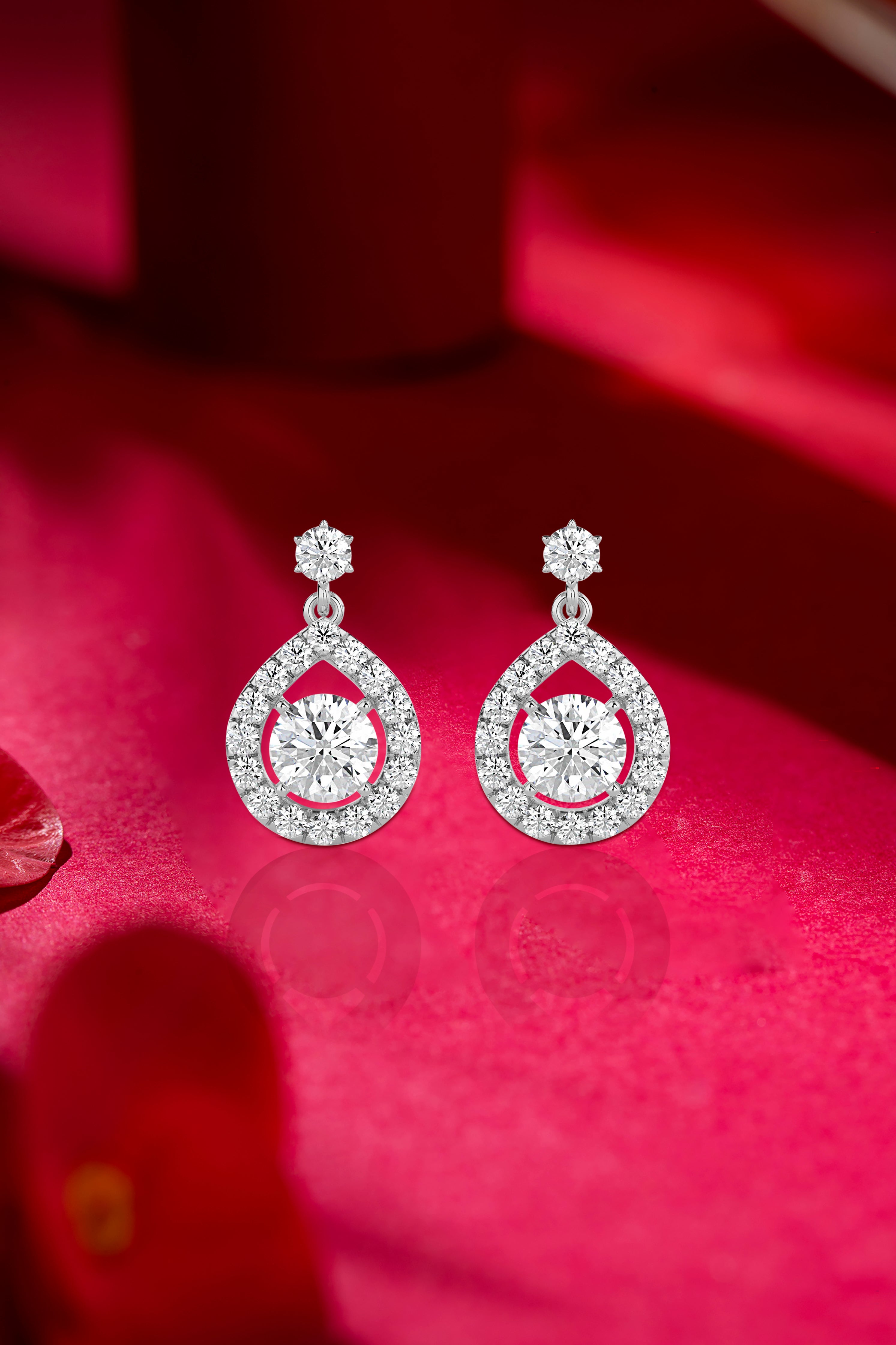 Cascading Brilliance: Pear-Shaped Halo Drop Diamond Earrings Audiam